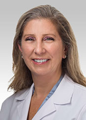 Ann Flores, PT,  PhD, CLT